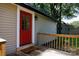 Side entrance of home featuring a red door, small deck, and vinyl siding at 118 Sunset Dr, Clover, SC 29710