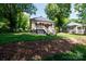 Inviting two-story home with mature trees, a lush lawn, and a welcoming front porch at 118 Sunset Dr, Clover, SC 29710