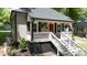 Front entrance with white stairs and railings, black shutters, and a red front door at 118 Sunset Dr, Clover, SC 29710