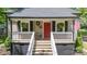 Charming home with a red front door, white porch railings, and plants at 118 Sunset Dr, Clover, SC 29710