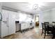 Open kitchen with stainless steel appliances, white cabinetry and an adjacent dining area at 118 Sunset Dr, Clover, SC 29710