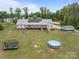 Aerial view of the backyard with trampoline, pool, large backyard and the home's solar panels at 1230 Long Creek Ln, Salisbury, NC 28146