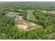 Aerial view of expansive land surrounded by a dense tree line at 1230 Long Creek Ln, Salisbury, NC 28146