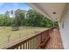 Back porch overlooking the vast green yard and mature trees at 1230 Long Creek Ln, Salisbury, NC 28146