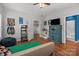 Bedroom featuring a bed, colorful decor, television and natural light at 1230 Long Creek Ln, Salisbury, NC 28146
