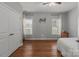 Neutral bedroom featuring hardwood floors, ample natural light, and a ceiling fan at 1230 Long Creek Ln, Salisbury, NC 28146