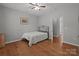 Bedroom with neutral paint, wood floors and a closet at 1230 Long Creek Ln, Salisbury, NC 28146