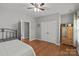 Bedroom with neutral paint, wood floors, closet, fan and plenty of natural light at 1230 Long Creek Ln, Salisbury, NC 28146
