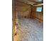 An interior view of a chicken coop with wood shavings, wood-paneled walls, and a small window at 1230 Long Creek Ln, Salisbury, NC 28146