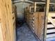 View of a wooden chicken coop with pens and chickens in the foreground at 1230 Long Creek Ln, Salisbury, NC 28146