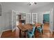 Inviting dining room showcasing an expansive wooden table and light-filled view to other rooms at 1230 Long Creek Ln, Salisbury, NC 28146