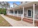 Inviting front porch with white railing, brick steps, and a 'Welcome' sign on the front door at 1230 Long Creek Ln, Salisbury, NC 28146