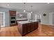Large kitchen features a center island with counter seating, sleek appliances, and abundant natural light at 1230 Long Creek Ln, Salisbury, NC 28146