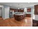Bright kitchen with stainless steel appliances, center island with seating and hardwood floors at 1230 Long Creek Ln, Salisbury, NC 28146