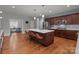 Spacious kitchen with a large marble island, stainless steel appliances, and hardwood floors at 1230 Long Creek Ln, Salisbury, NC 28146