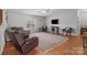 Spacious living room featuring hardwood floors, large windows, and comfortable seating arrangement at 1230 Long Creek Ln, Salisbury, NC 28146