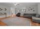 Open living room boasts hardwood floors and ample seating, creating an inviting and airy atmosphere at 1230 Long Creek Ln, Salisbury, NC 28146