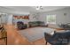 Comfortable living room featuring hardwood floors and a cozy seating area, connected to kitchen at 1230 Long Creek Ln, Salisbury, NC 28146