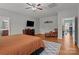View of main bedroom with hard wood floors, ceiling fan and dresser at 1230 Long Creek Ln, Salisbury, NC 28146