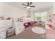 bedroom with lofted bed, pink rug, ceiling fan, and natural light at 12408 Savannah Cottage Dr, Charlotte, NC 28273