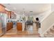Open floor plan with kitchen featuring stainless steel appliances and granite countertops at 12408 Savannah Cottage Dr, Charlotte, NC 28273