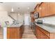 Spacious kitchen featuring an island with granite countertops and modern stainless steel appliances at 12408 Savannah Cottage Dr, Charlotte, NC 28273