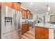Open floor plan with kitchen featuring stainless steel appliances and granite countertops at 12408 Savannah Cottage Dr, Charlotte, NC 28273