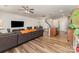 Open floor plan with living room, dining area, and kitchen featuring modern finishes and ample space at 12408 Savannah Cottage Dr, Charlotte, NC 28273