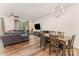 Open floor plan with living room, dining area, and bright natural light at 12408 Savannah Cottage Dr, Charlotte, NC 28273