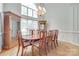 Formal dining room with hardwood floors, large window, and an elegant chandelier at 1305 Yellowood Ct, Rock Hill, SC 29732