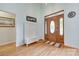 Inviting foyer with hardwood floors, a stylish wooden door, and a cozy bench at 1305 Yellowood Ct, Rock Hill, SC 29732