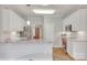 Modern kitchen with white cabinets, granite countertops, and stainless steel appliances at 1305 Yellowood Ct, Rock Hill, SC 29732