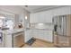 Stylish kitchen with white cabinets, granite countertops, and stainless steel appliances at 1305 Yellowood Ct, Rock Hill, SC 29732