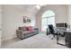 Cozy office with vaulted ceilings featuring a comfortable sofa and work desk at 1305 Yellowood Ct, Rock Hill, SC 29732