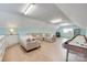 Inviting rec room featuring a large sectional sofa, a lamp, a storage cabinet and a billiard table at 1305 Yellowood Ct, Rock Hill, SC 29732