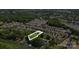 Aerial view of the property showcasing its location near a lake and wooded surroundings at 132 Flora Vista Dr, Mooresville, NC 28117