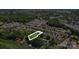 Gorgeous aerial view of home's location on private, wooded lot with lake access and community amenities at 132 Flora Vista Dr, Mooresville, NC 28117