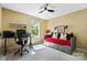 Versatile bedroom space with a daybed, workspace, ceiling fan, and a window that provides ample natural light at 132 Flora Vista Dr, Mooresville, NC 28117