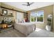 Comfortable bedroom featuring a large window and shelving on a pipe frame for storing books and decorations at 132 Flora Vista Dr, Mooresville, NC 28117