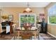 Cozy dining area featuring a wooden table, chair seating, and sliding glass doors leading to an outdoor patio at 132 Flora Vista Dr, Mooresville, NC 28117