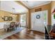 Elegant dining room with hardwood floors, neutral walls, and large windows at 132 Flora Vista Dr, Mooresville, NC 28117