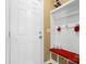 Charming entryway with a white door, built-in bench, and storage, creating a welcoming and organized space at 132 Flora Vista Dr, Mooresville, NC 28117