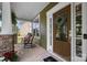 Inviting front porch with rocking chairs and a view of the home's beautiful landscaping at 132 Flora Vista Dr, Mooresville, NC 28117