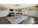 Spacious game room with a ping pong table, large TV, and ample lighting at 132 Flora Vista Dr, Mooresville, NC 28117