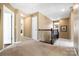 Upstairs hallway with neutral carpet, white doors, and view of multiple rooms at 132 Flora Vista Dr, Mooresville, NC 28117