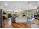 Open-concept kitchen with white island, seamlessly flows into the living and dining areas, great for entertaining at 132 Flora Vista Dr, Mooresville, NC 28117