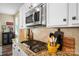 Close-up of a kitchen features granite countertops, modern stainless steel appliances, and charming decorative accents at 132 Flora Vista Dr, Mooresville, NC 28117