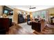 Cozy living room with fireplace, hardwood floors, and comfortable seating at 132 Flora Vista Dr, Mooresville, NC 28117