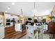 Open-concept living space features a dining area that connects the kitchen and living room in a seamless design at 132 Flora Vista Dr, Mooresville, NC 28117