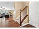 Elegant staircase with wooden banister and carpeted steps, connecting the home's multiple levels with style and safety at 132 Flora Vista Dr, Mooresville, NC 28117